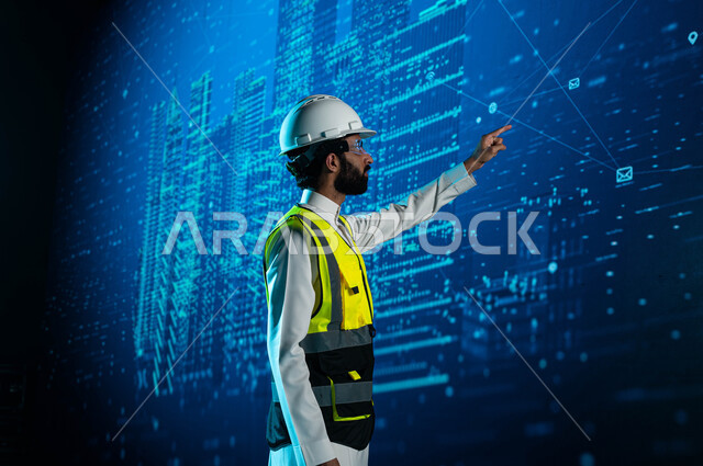 Integration of technology and technology in the field of architecture, a Saudi Arabian Gulf engineer who wears virtual reality glasses and follows Saudi towers, buildings and skyscrapers through a 3D hologram screen, advanced engineering designs and plans