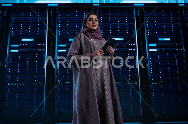 Cloud storage network, managing the servers control room and giant internet servers, a Saudi Arab Gulf woman using a tablet, benefiting from Saudi expertise in developing the data center, a 3D hologram background for the data center