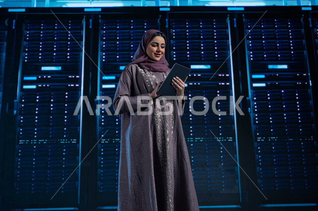 3D hologram background for servers and Internet servers control room, investing Saudi expertise in building advanced and modern data centers, a Saudi Arab Gulf woman using a tablet to supervise and manage data center information, the concept of cloud stor