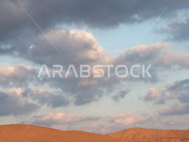 Clouds and mountain peaks in the state of Khasab, the natural, mountainous and archaeological formation of the state of Khasab, the regional center of the Governorate of Musandam in the Sultanate of Oman, famous natural tourist places and attractions.