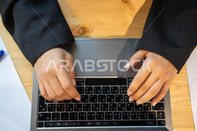 Developing a business strategy and growth plan, a vertical close-up of an employee performing work tasks using a computer, the analysis and statistical department, monitoring the economy and financial information, the company's profit and loss data.