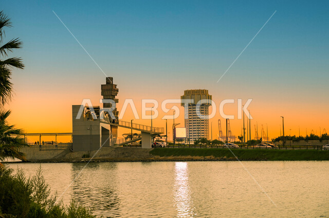 The waterfront of the city of Jeddah Al-Balad, the engineering art of the towers and skyscrapers, the sunset over the eastern coast of the Red Sea in the Kingdom of Saudi Arabia, residential and commercial buildings in Jeddah, famous places and tourist at