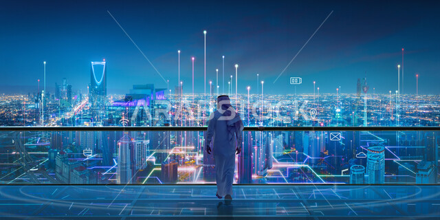 تزويد الاماكن الحديثة بالانترنت, صورة من الخلف لرجل عربي خليجي سعودي يرتدي الزي التقليدي, استخدام التقنية والتكنولوجيا في انشاء المدن الحديثة، البنية التحتية الرقمية، قطاع تكنولوجيا المعلومات الرقمية و الإتصالات في السعودية، رؤية 2030
