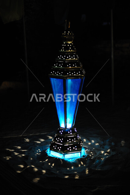 Traditional metal Arab lantern, lighting and decorations to celebrate the advent of the month of Ramadan, Ramadan decorations, lights and atmosphere, preparation for the holy month, religious occasions and Islamic holidays, black background