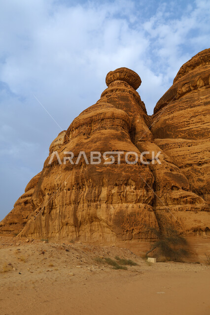 Ancient historical monuments in Madain Saleh, mountain peaks and heights in Al-Ula Governorate in the Kingdom of Saudi Arabia, natural rock formations in desert areas, tourism in Saudi Arabia