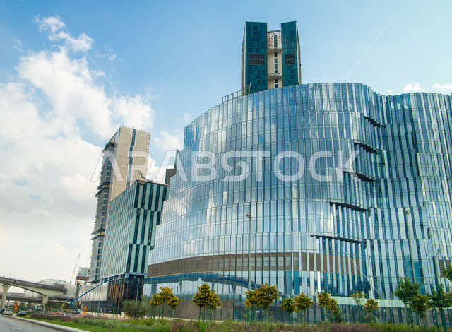 Compete and continue to develop the distinguished engineering designs of buildings, the towers of the King Abdullah Financial District (KAFD) in Riyadh, Saudi Arabia, famous places and tourist attractions in Riyadh in broad daylight, the architectural art