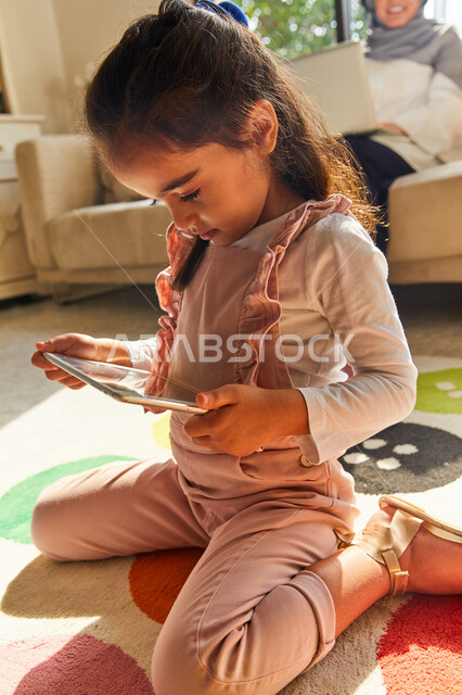 Child using tablet.