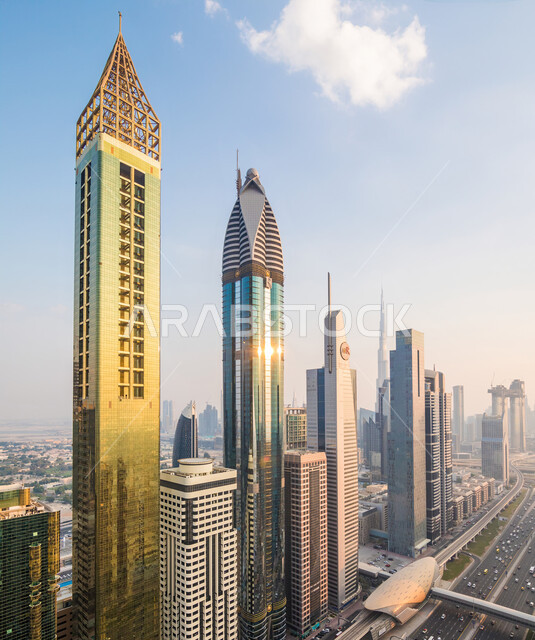 Attention to the infrastructure and the general appearance of the Emirate of Dubai, an aerial view of the Dubai skyline and skyscrapers in the city center in the United Arab Emirates at sunset, the transportation network, main roads and streets, the conce