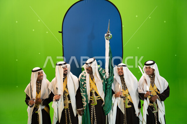 ذكرى يوم العلم السعودي، ايماءات السعادة بالاحتفال باليوم الوطني السعودي 23 سبتمبر، فنون وعروض الفلكلور التراثي السعودي، ارتداء الدقلة والغترة الشعبية، أزياء المناسبات الوطنية التقليدية، فرقة العرضة النجدية والرقص الشعبي بالسيوف،  خلفية خضراء وزرقاء، كروما