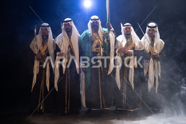 Celebrating Science Day on March 11, a traditional folklore performance group on National Day on the 8th of Rabi’ al-Awwal, wearing the popular Najdi parade costume, folk dancing with swords and chants, and celebrations on national occasions, a black back