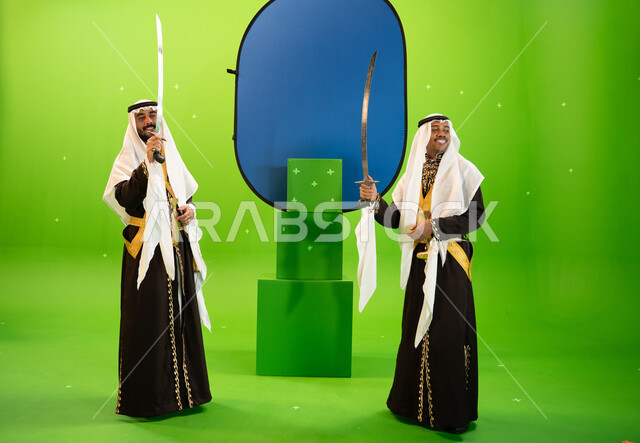 Showing the heritage of the western region, celebrating the anniversary of the founding of the first Saudi state on February 22, using swords in folk dance, two Saudi Arab men from the Najdi Ardha band wearing ghutra and dakhla, full-length body portrait,