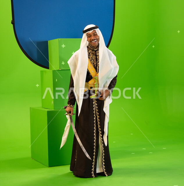 إظهار التراث والثقافة السعودية بأداء العرضة النجدية، الاحتفال بذكرى تأسيس الدولة السعودية الأولى 22 شباط, استخدام السيوف في الرقص الشعبي، ارتداء أزياء المناسبات الوطنية، فنون وعروض الفلكلور التراثي ، صورة الجسم بالطول الكامل، خلفيه خضراء و زرقاء ،كروما