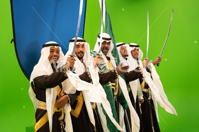 Singing and reciting passionate poems and Saudi poetry, popular festivals, dancing with swords and chants on national occasions and holidays, wearing Najdi Ardha costumes, commemorating the Saudi National Day on September 23, celebrating Flag Day on March