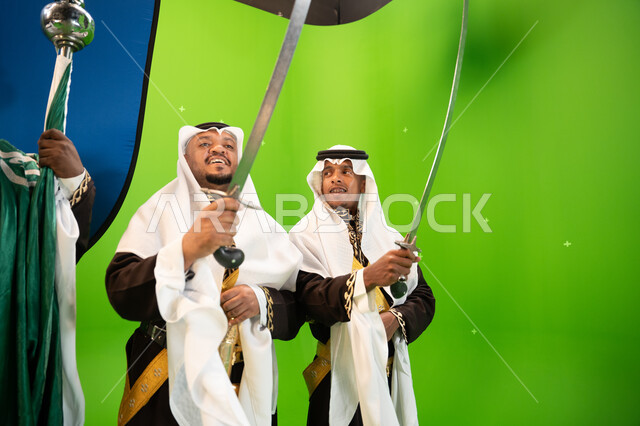 Traditional folklore performances on the anniversary of the Saudi National Day on September 23, folk festivals, dancing with swords and chants on national occasions and holidays, wearing Najdi ardha costumes, Saudi National Day, celebrating Flag Day on Ma