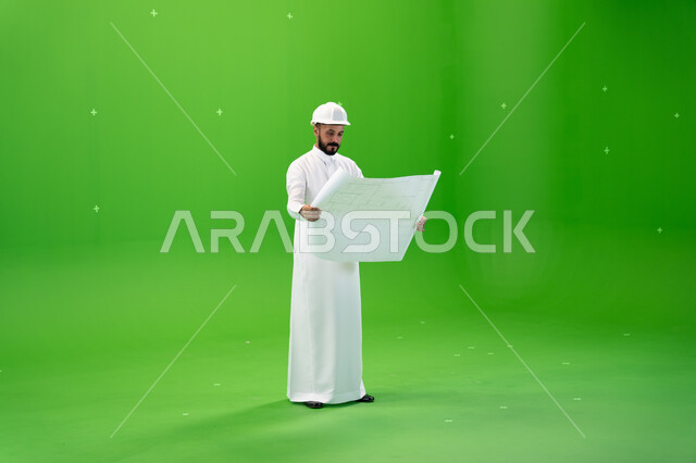 Supervision and auditing of work, a portrait of a Saudi Arabian Gulf engineer wearing a protection hat standing at the work site, engineering jobs in Saudi companies, the concept of engineering and construction, reconstruction by the hands of the people o