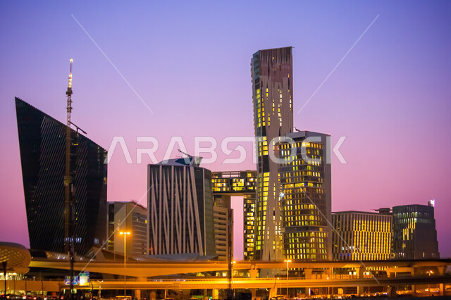Famous landmarks of Riyadh, King Abdullah Financial Center in Riyadh, Saudi Arabia at night, illuminated towers and skyscrapers, distinguished architectural growth and development in Saudi Arabia, economic and financial towers in CAFD, roads and streets of the Kingdom
