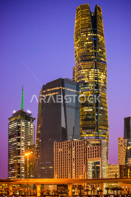 A close-up of the King Abdullah Financial Center in Riyadh, Saudi Arabia at night, the famous landmarks of Riyadh, the illuminated towers and skyscrapers, the distinguished architectural growth and development in Saudi Arabia, the economic and financial towers in CAFD