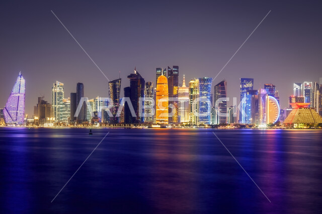 The development of Arab buildings and engineering landmarks, skyscrapers in Doha, the architectural art of the lit-up towers at night time, famous tourist places and areas, the importance of the role of tourism in the city of Qatar, enjoying the quiet atmosphere at night