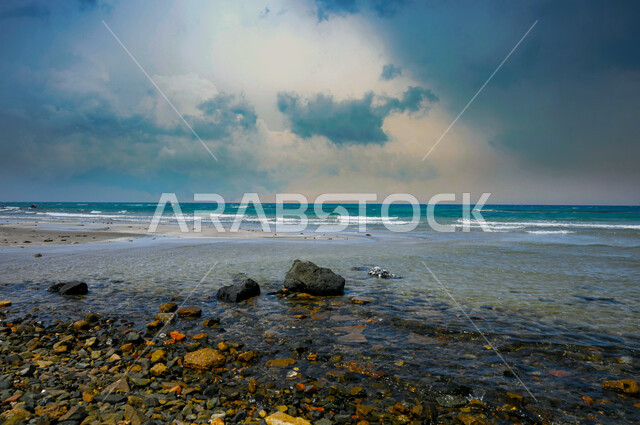 Relax and enjoy the tranquility of nature, the natural landscape on the beaches of Umluj in the city of Tabuk, a close-up of the sand rocks on the shore of the Red Sea, famous tourist places in the Kingdom of Saudi Arabia, a destination that attracts tourists from different countries of the world