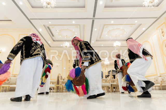 Reviving a wonderful atmosphere for a Saudi Gulf groom in the wedding hall, the party is revived by the Najdi Arda band, a performance art that combines dance and drums, celebrations in the Saudi wedding