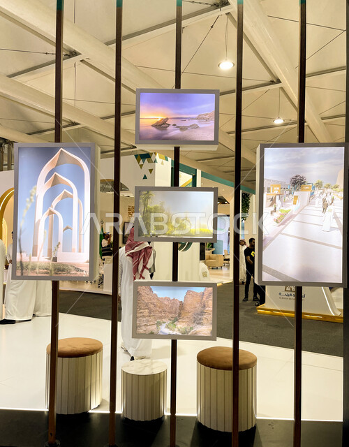 Artistic paintings of famous Saudi tourist places and landmarks, the future Saudi Vision 2030, the Cityscape International Exhibition for the real estate sector, the Riyadh Exhibition and Convention Center in the town of Mulham, attention to the designs and interior decorations of the exhibition