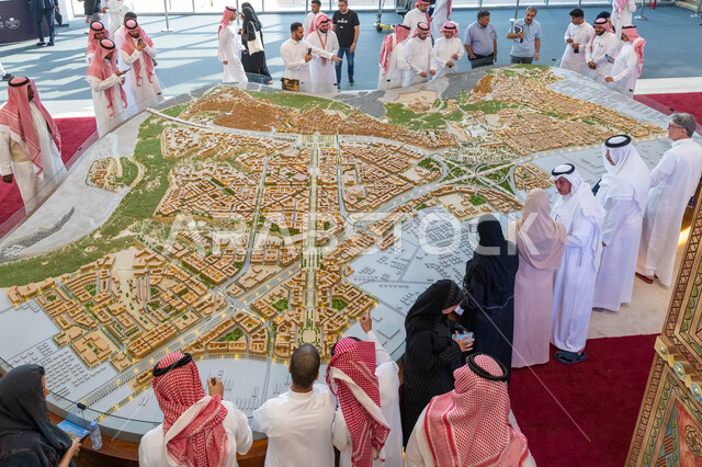 Masterpieces of architectural designs and creativity of designers, visitors gathered in front of models of residential and commercial complexes in the Diriyah pavilion at the Cityscape International Exhibition, investment opportunities in residential and commercial projects, the Riyadh Exhibition Center in the town of Mulham in Saudi Arabia, a future Saudi vision 2030.