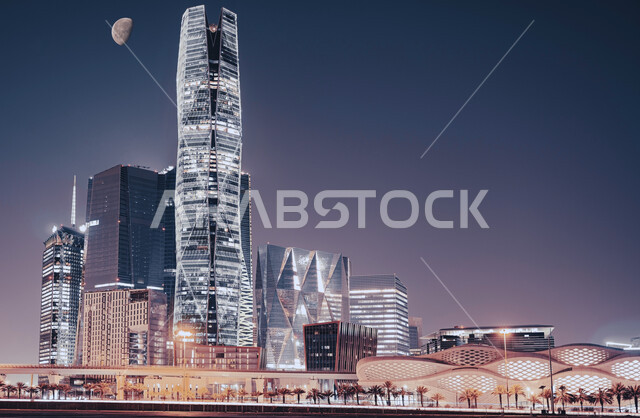 إطلالة متميزة لمركز الملك عبدالله المالي ( كافد ) في السعودية ليلا ،  معالم الرياض المشهورة، الفن الهندسي المعماري للأبراج وناطحات السحاب في المملكة ، أماكن ومقاصد سياحية .