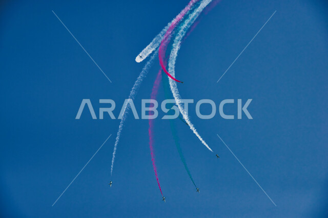 Saudi aviation displays during National Day celebrations on September 23, Flag Day events on March 11, military air shows, Saudi National Day, military aircraft flying in the skies of the Kingdom of Saudi Arabia, decorating the sky with colored smoke, the Saudi Entertainment Authority