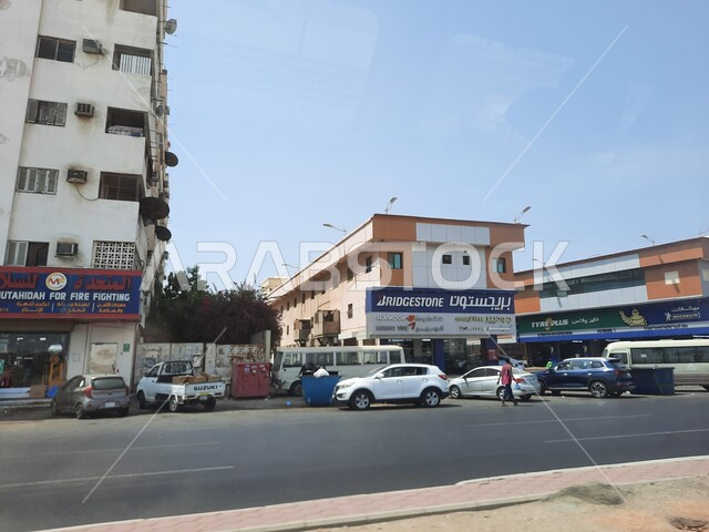 Markets and shops in the Kingdom, car traffic on the old Mecca Road in the city of Jeddah, public roads and streets of Saudi Arabia in broad daylight, famous landmarks and places of Jeddah.