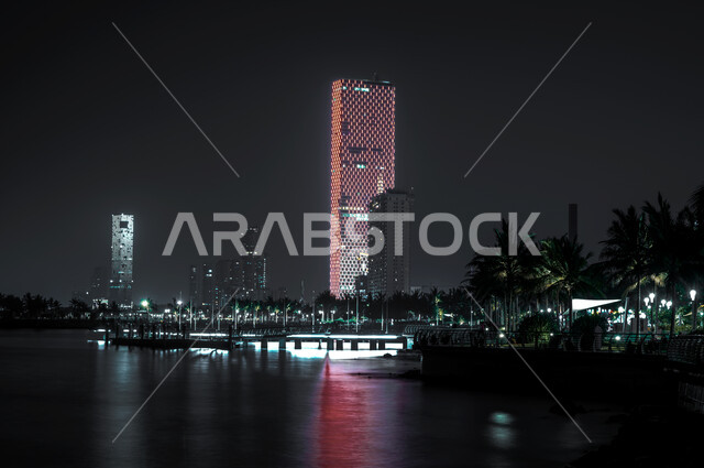 Urban growth and development, the waterfront of the new Jeddah Corniche in the Kingdom of Saudi Arabia, the architectural art of towers and skyscrapers illuminated at night, famous tourist attractions.