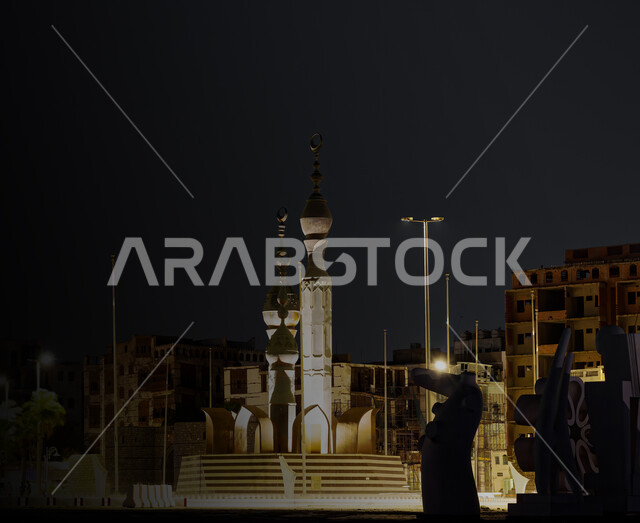 Illuminated archaeological objects at night in Jeddah Roundabout in Al-Balad neighborhood, architectural art of ancient historical monuments, famous tourist places in the Kingdom of Saudi Arabia