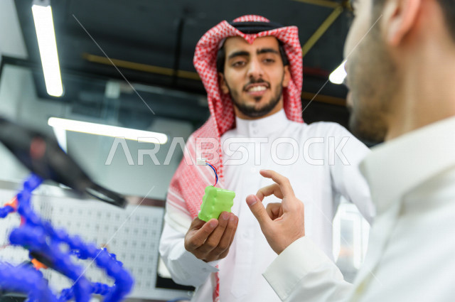 An innovative Saudi youth doing experiments on electrical circuits, using artificial intelligence for manufacturing, an academy specializing in science, technology, engineering and mathematics