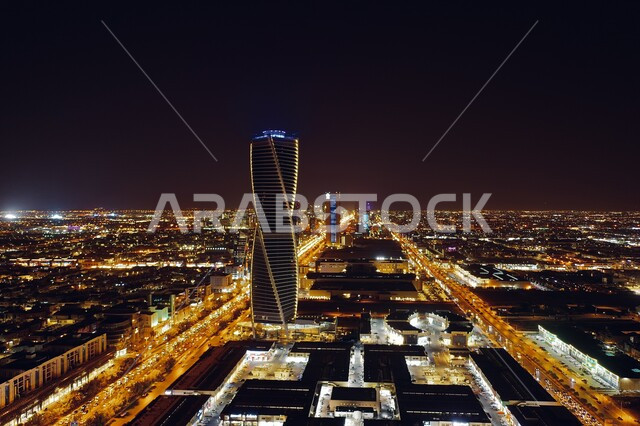 Enjoying the tranquil night scenery, the Majdool Tower in the skyline of the entertainment tourist city of Riyadh at night time, the urban development of towers and skyscrapers in the Kingdom of Saudi Arabia, the illuminated buildings and facilities of the entertainment and entertainment capital, tourist places and landmarks