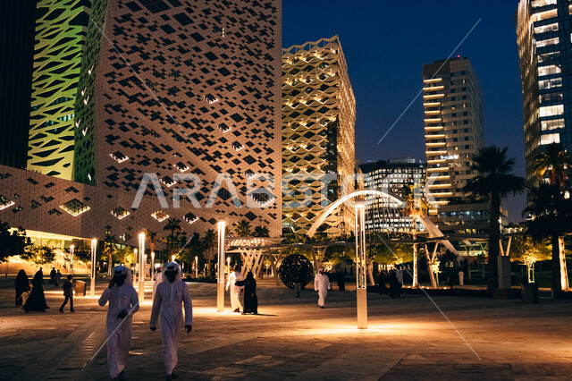 Engineering art in the modern and advanced architectural style, the development and development of urbanism in the city of Riyadh, financial towers and economic facilities illuminated at night, the King Abdullah Financial Center (KAFD) in the Kingdom of Saudi Arabia, famous tourist attractions