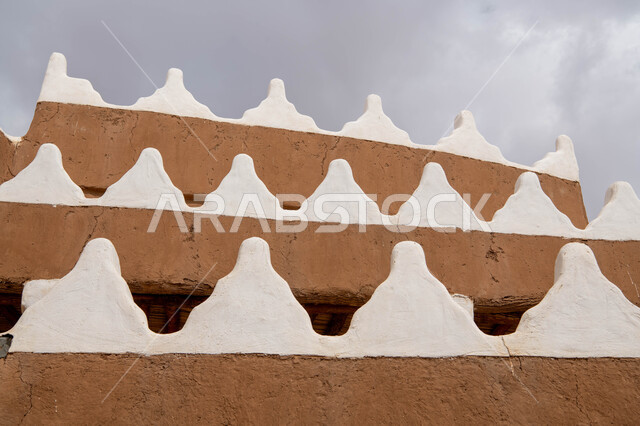Islamic architecture in the old Najdi style in the historic city of Riyadh, a thick heritage mud wall, heritage architecture, famous landmarks and tourist places in the Kingdom of Saudi Arabia