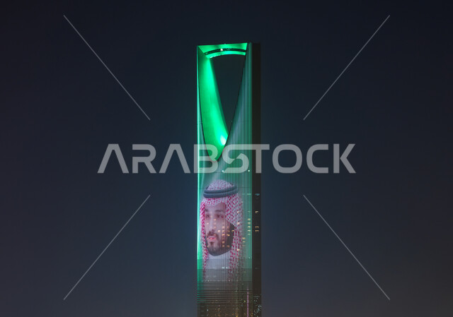 Founding of the Saudi state 1727 AD, Science Day March 11, close-up of Crown Prince Mohammed bin Salman bin Abdulaziz on the Kingdom Tower lit in green in celebration of National Day on September 23 and National Day, architectural engineering art of towers and skyscrapers in Riyadh