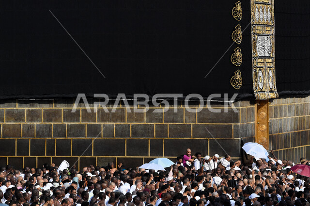Performing the rituals of Hajj and Umrah, sacred Islamic religious landmarks and places, pilgrims circumambulating the Sacred House of God near the Holy Kaaba in the Holy Mosque of Mecca in Mecca in the Kingdom of Saudi Arabia during the daytime, worship and getting closer to God, Hajj season 202