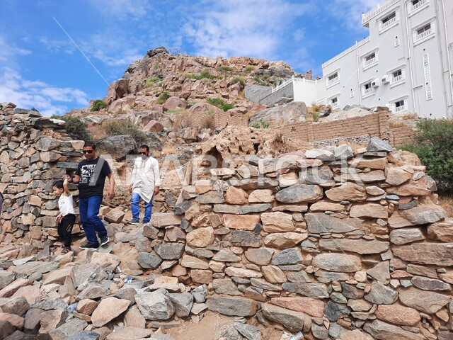 Modern advanced buildings, a close-up picture for visitors and tourists of the historical Al-Arfaa ruins in the city of Taif, the Abbasid style of construction, a heritage and civilizational symbol of cultural events, ancient castles and forts, and the green mountainous nature in the Kingdom of Saudi Arabia