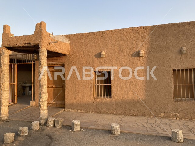 Interest in Islamic landmarks to attract tourists from all over the world, heritage designs in the Kingdom of Saudi Arabia, famous religious historical places in the Huailan Buraidah area, a close-up picture from the outside of a mud mosque built in the old historical style in the city of Qassim