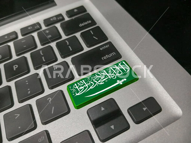 The concept of distance education using technology, the use of smart and advanced devices, a close-up of a computer keyboard, the celebration of the Saudi National Day, companies and offices in Saudi Arabia, tools and personal items.