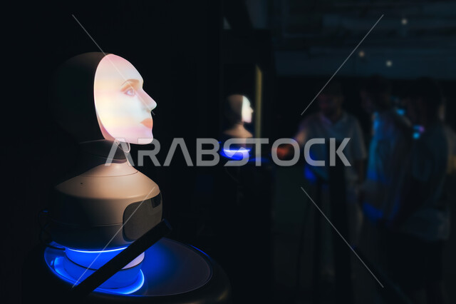 An artificial intelligence robot at the NEOM exhibition, the development of digital technology, learning about the future of urban communities, global developments in innovative designs, models and models of the designs of the future city “The Line” in Riyadh, visual displays, engineering and architectural techniques, a Saudi future vision 2030