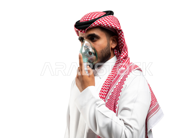 Treating chronic asthma diseases, maintaining a regular airway using a respirator, a close-up portrait of a Saudi Gulf Arab man wearing a shemagh and traditional