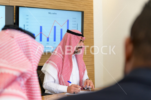 Administrative meeting with a group of Saudi Gulf people in the conference room, a Saudi company, business partners, work environment