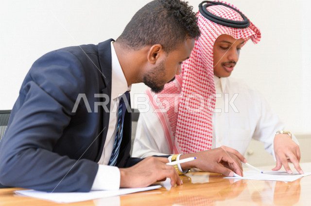 Administrative meeting with a group of Saudi Gulf people in the conference room, a Saudi company, business partners, work environment