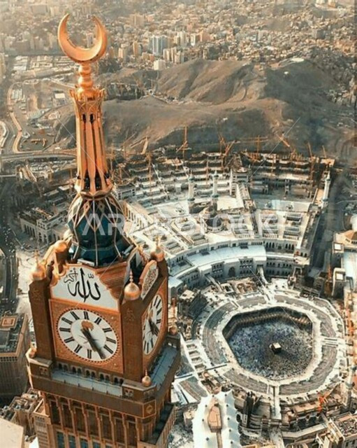 The Holy Mosque of Mecca in Mecca, a picture from above of the Royal Clock Tower building in broad daylight, sacred Islamic religious places and landmarks, the Kingdom of Saudi Arabia, performing Hajj and Umrah rituals, worship and getting closer to God