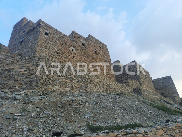 Mountain peaks and highlands in the Kingdom, preparing and renovating heritage places to attract and attract tourists, the ancient architectural design of the houses and buildings of the historic archaeological village of Dhi Al Ain in the Al Bahah region, the building constructed of stones and trunks of Sidr trees, the unique urban art of volcanic stones