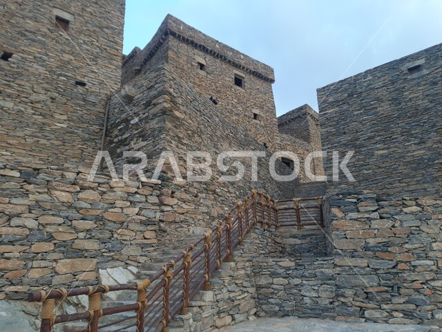 The ancient architectural design of the houses and buildings of the historical archaeological village of Dhi Al-Ain in the Al-Baha region, the preparation and renovation of heritage mountainous places to attract and attract tourists, the building constructed of stones and trunks of Sidr trees, the unique urban art of volcanic stones