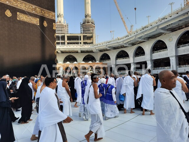 Worship and getting closer to God, a close-up picture of a group of pilgrims in Mecca, circumambulating around the Holy Kaaba, the Holy Mosque of Mecca in the Kingdom of Saudi Arabia, performing Hajj and Umrah rituals, Islamic matters and worship, sacred Islamic places and landmarks, Hajj season