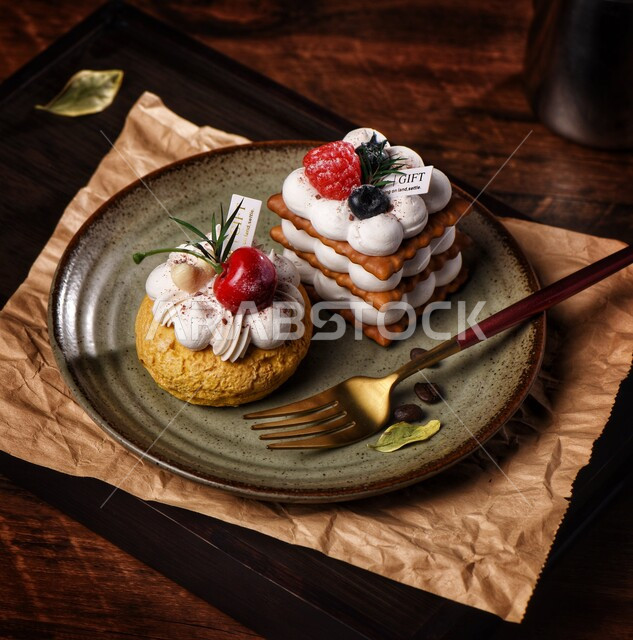A piece of sweets and biscuits decorated with wild fruits on a glass plate, delicious food recipes and dishes, Saudi Arabian Gulf restaurants, freshly baked sweets, high-calorie sweets, wooden backgrounds