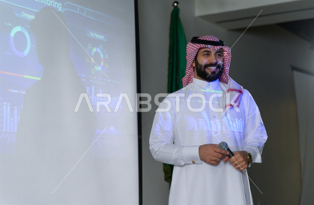 Close-up picture of a Saudi businessman, a speaker and a participant in the businessmen and companies training course, business development and partnerships, a business meeting, training course, employee meeting, university lecture